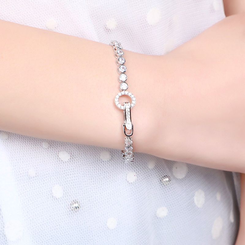 Eternal Elegance: Sterling Silver Round Buckle Tennis Bracelet with Cubic Zirconia